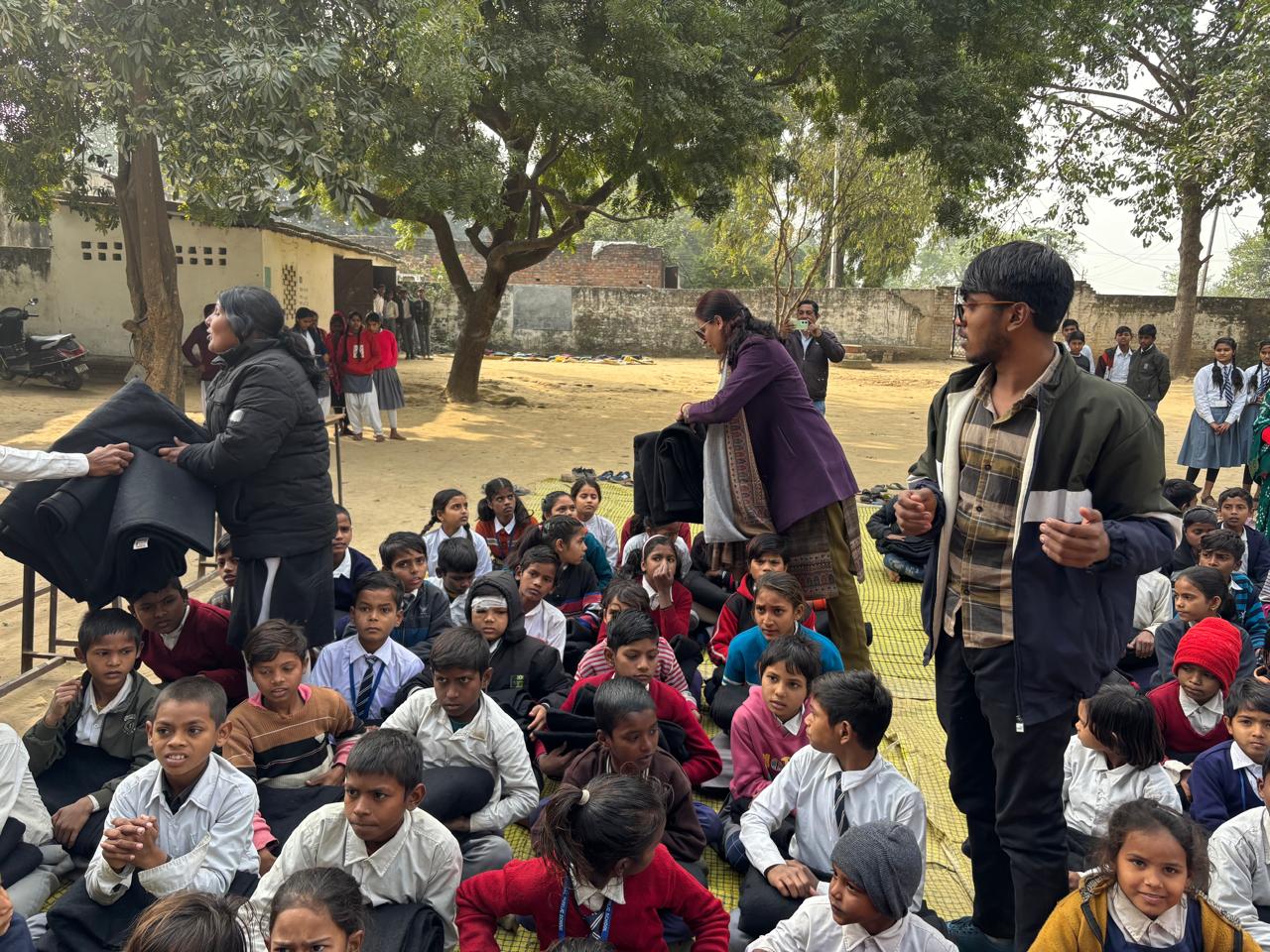 Handing over blankets to school principal